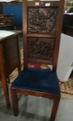 A pair of oak high-back chairs with two carved panels depicting gods and goddesses (old marks and