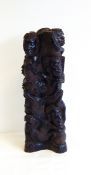 An African carved ebony figure group of numerous figures entwined, 36cm approx.