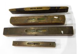 Four antique brass bound wooden levels