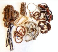A quantity of African seed pod necklaces,