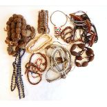 A quantity of African seed pod necklaces,