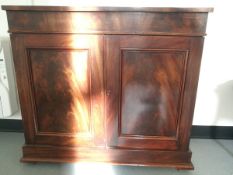 A 19th century mahogany side cupboard with under-cupboard and two exposed single shelves,