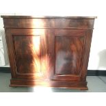 A 19th century mahogany side cupboard with under-cupboard and two exposed single shelves,