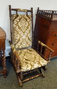 A 20th century oak seat with bobbin turned arms and supports,