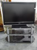 A Sony Bravia flatscreen television with stand