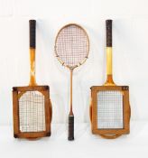 Two wooden tennis racquets, badminton racquet,