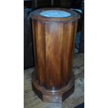 A mahogany circular cabinet with marbled top, enclosed shelf (the top has broken off),