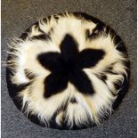 A black and white monkey skin rug