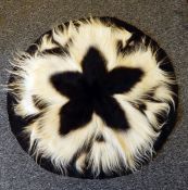 A black and white monkey skin rug