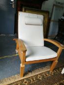 A pair of Arbor Vetum hardwood framed conservatory armchairs