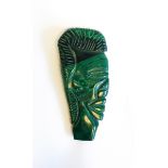 An African carved malachite profile bust of figure's head,