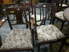 Eight mahogany dining chairs with floral seats,