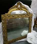 A modern giltwood carved overmantel mirror with floral and scroll decoration together with another