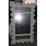 A modern white painted mirror with floral decoration,