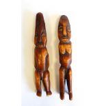 Pair of African carved and stained ivory male and female fertility figures, 15cm long approx.