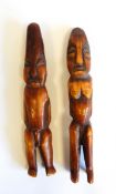 Pair of African carved and stained ivory male and female fertility figures, 15cm long approx.