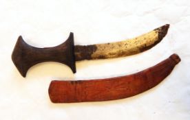 Three small African daggers with carved wooden handles and leather scabbards and two straight