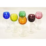 A set of six cut glass harlequin hock glasses,