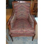 A mahogany dressing chair with patterned cushions