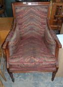 A mahogany dressing chair with patterned cushions