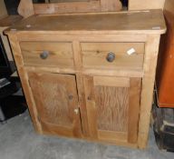 A pine cabinet with two short drawers, under cabinet,
