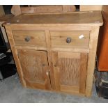 A pine cabinet with two short drawers, under cabinet,