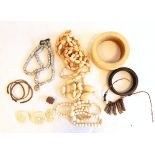 PLEASE NOTE IVORY WITHDRAWN AND LOTS 2064 AND 2065 MERGED Large African bangles, bead necklaces,