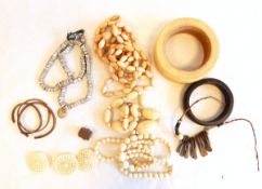 PLEASE NOTE IVORY WITHDRAWN AND LOTS 2064 AND 2065 MERGED Large African bangles, bead necklaces,