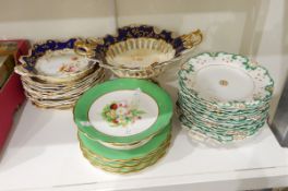 A Victorian dessert service painted with roses and other flowers within a blue and gilt border,