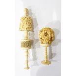 An Oriental carved puzzle ball on stand, an Oriental carved decorative item with pierced basket,