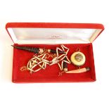 PLEASE NOTE IVORY ITEMS REMOVED A small antelope horn pendant with gold-coloured metal mount and