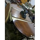 A mahogany D-end extending dining table with walnut and ebonised inserts,