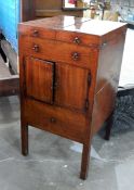 A George III mahogany washstand, the hinged folding cover revealing a recess for bowl,