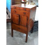 A George III mahogany washstand, the hinged folding cover revealing a recess for bowl,