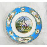 A continental porcelain plate, the central scene depicting a shepherd and his maid by a waterfall,