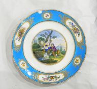 A continental porcelain plate, the central scene depicting a shepherd and his maid by a waterfall,