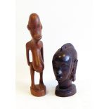 A carved African hardwood bust of woman's head, on circular base, probably ebony, 13.