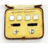 A set of four mother-of-pearl buttons and a pair of matching collar studs of square design,