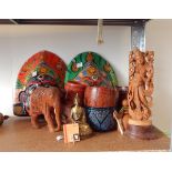 An Indian carved sandalwood figure of Parvati, another carved figure, carved elephants,