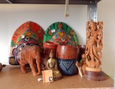 An Indian carved sandalwood figure of Parvati, another carved figure, carved elephants,