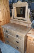 An Edwardian bleached pine dressing chest fitted three drawers with oxidised metal handles,