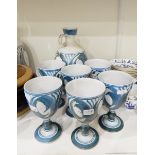 An Aldermaston pottery decanter and six matching goblets painted in blue on grey ground