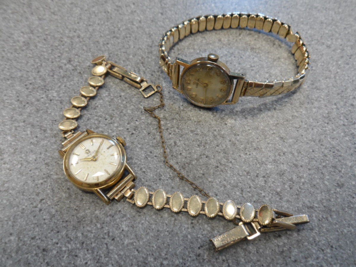 Two lady's Omega rolled gold wristwatches