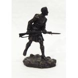 A bronze model of WWI soldier carrying rifle, signed indistinctly "G L Movio, London, 1915"(?),