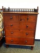 A mahogany chest of two short and three long graduated drawers with guard rail edge,