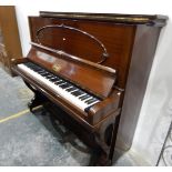 An Amyl upright overstrung piano