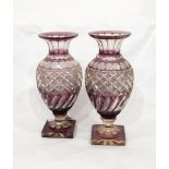 A pair of Victorian amethyst flash cut glass vases of baluster form with half-fluted and hobnail