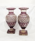 A pair of Victorian amethyst flash cut glass vases of baluster form with half-fluted and hobnail