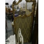 A gilt three-fold screen with glass top section and gold and bronze floral pattern,