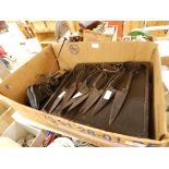 A large quantity of iron shearing scissors, 19th century steel yard with shaped pans, etc.